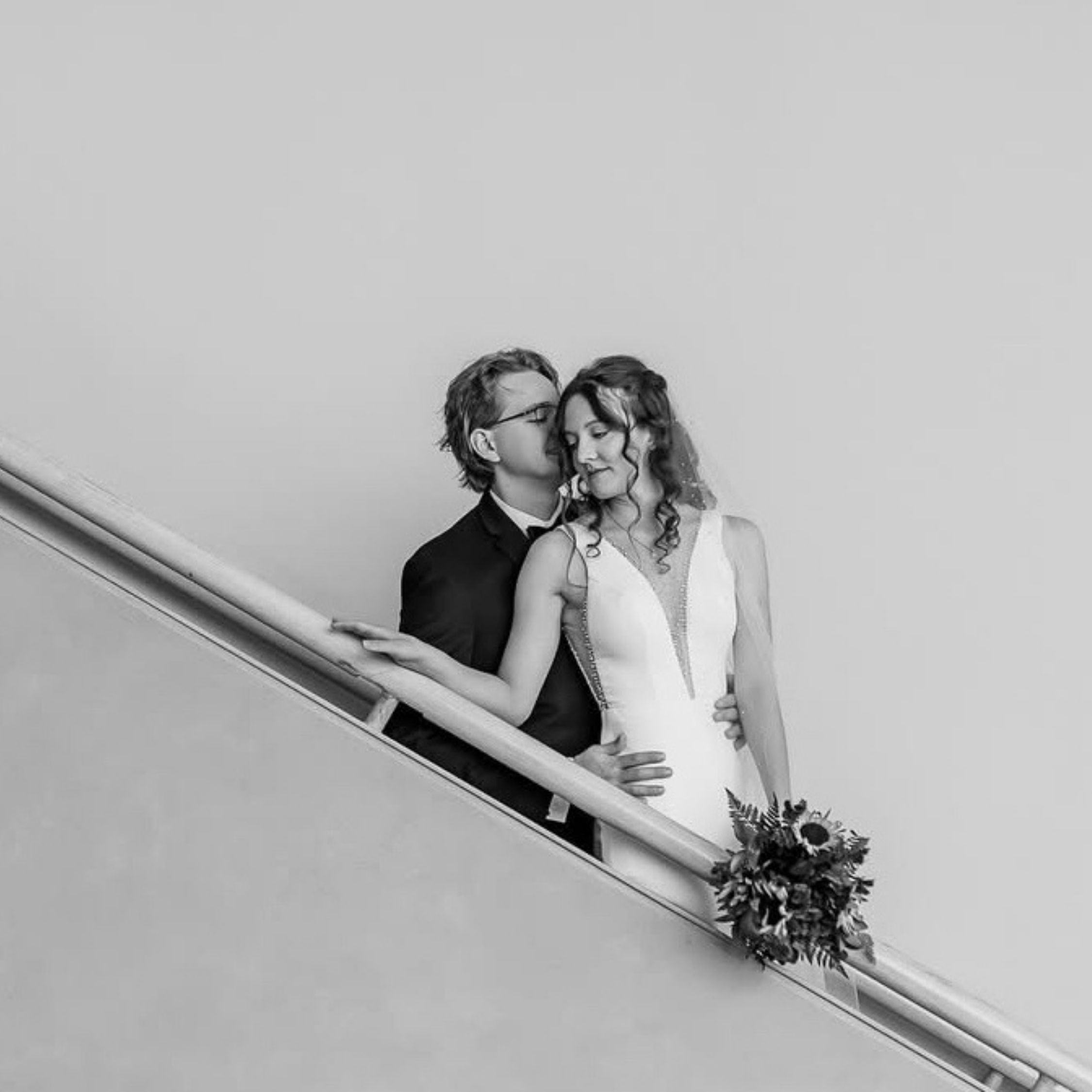 bride and groom on a staircase