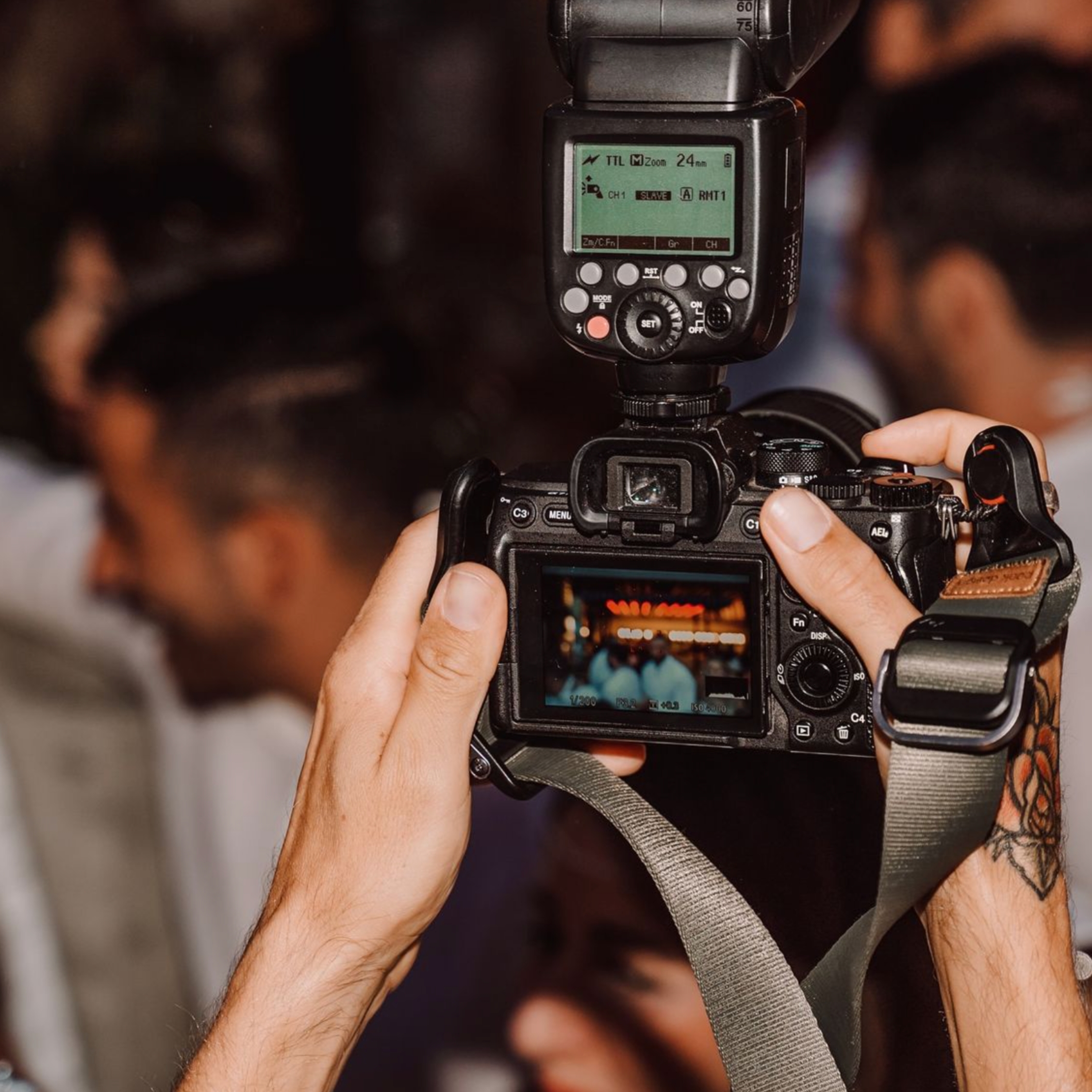 wedding photographer holding up a camera