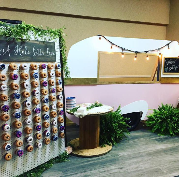 Donut wall and photo booth created by Blushed Event and Design Co