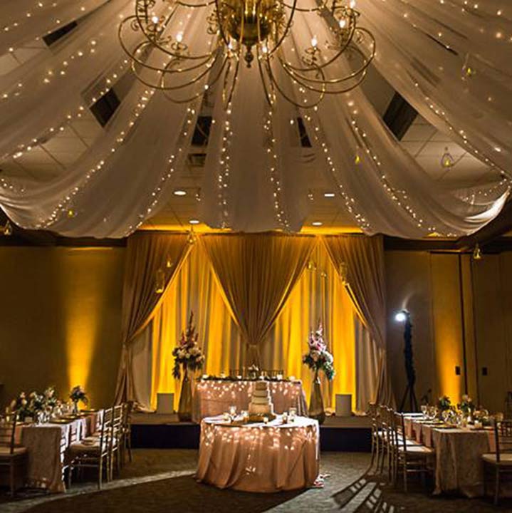 large room inside Thelma Keller Convention Center setup for a wedding reception